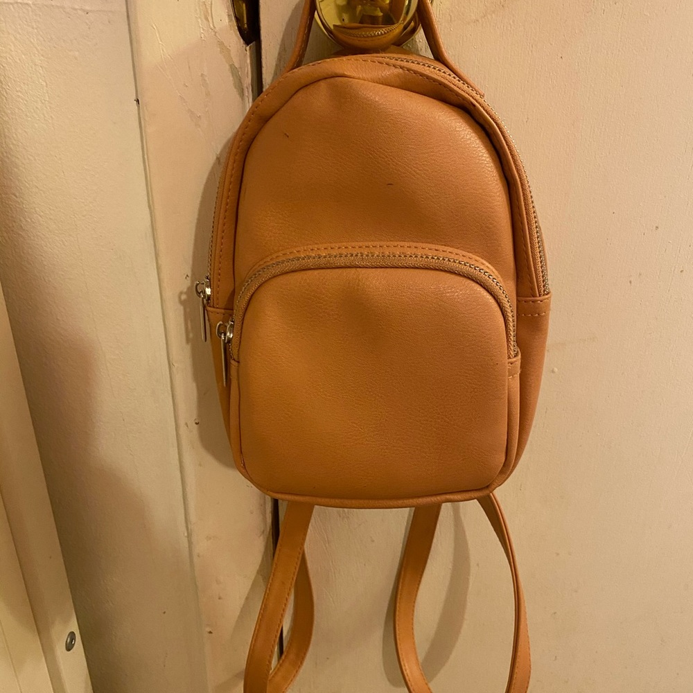 a creamy orange mini backpack 🧡